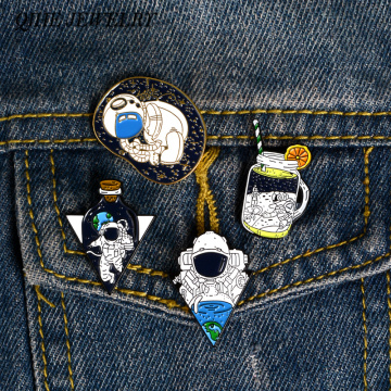QIHE JEWELRY 4styles Magic Astronaut Embryo Space Shrinking Earth Enamel pin Brooches Badges Cartoon Astronaut Pins collection