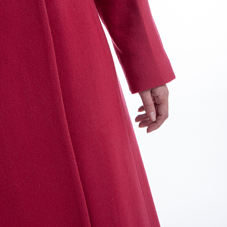 The sleeves of a red cashmere overcoat The sleeves of a red cashmere overcoat
