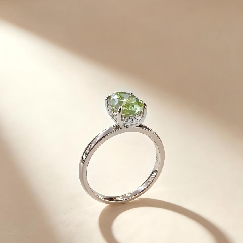 Side profile of a 2.01 carat Fancy Vivid Green oval lab diamond ring with a diamond-set gallery