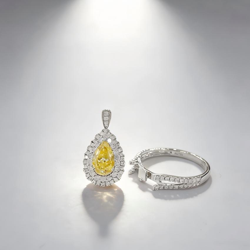 Detachable yellow pear diamond halo centerpiece shown beside its split shank ring base