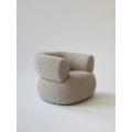 Moving Mountains Puffer chair by boucle fabric