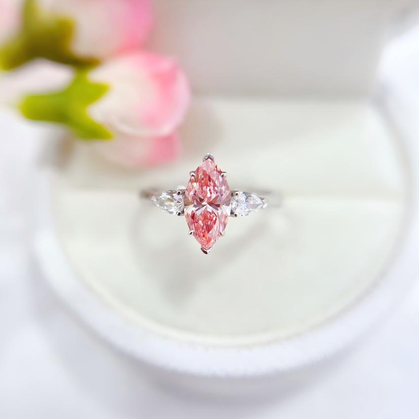 1.05 carat Fancy Vivid Pink marquise lab diamond three-stone ring with pear side stones