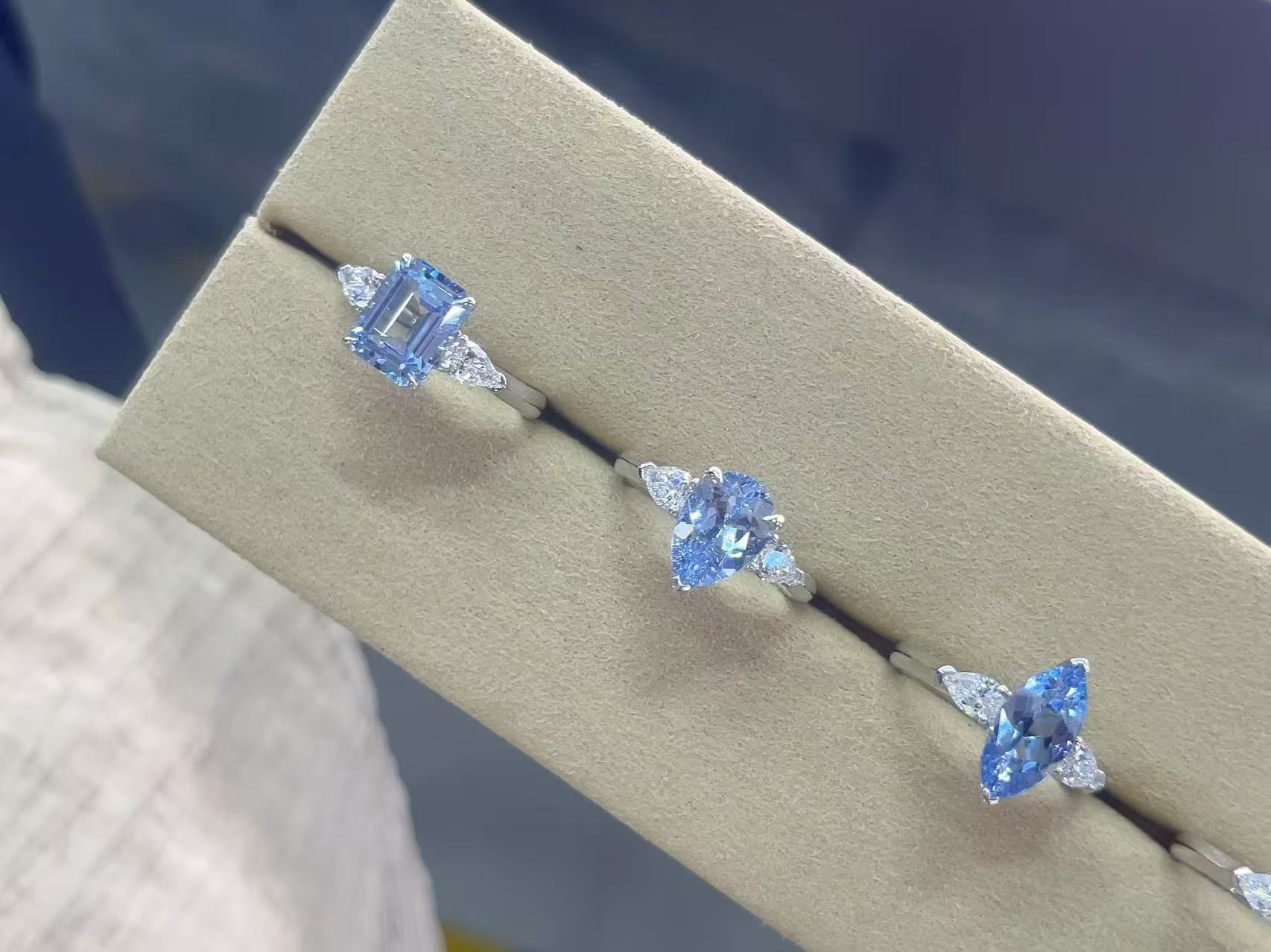 Fancy shape blue lab diamond three stone ring series with pear side diamonds