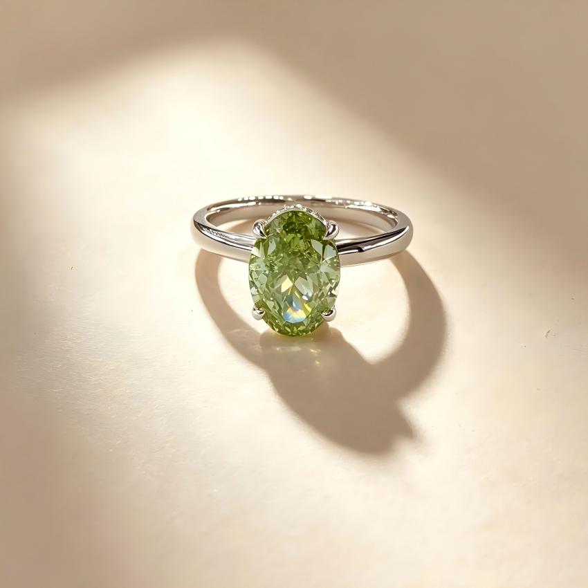 Front view of a 2.01 carat Fancy Vivid Green oval lab diamond solitaire ring in 18K white gold
