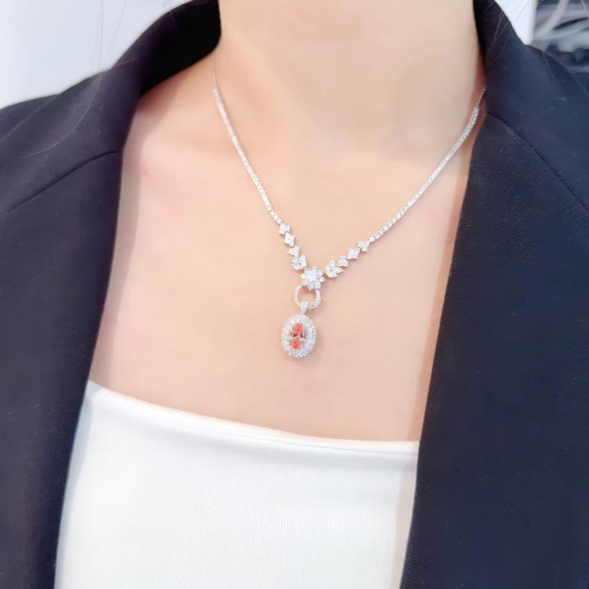 Detachable oval pink lab diamond halo centerpiece worn as a pendant