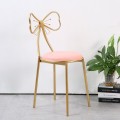 Gold leg pink seat