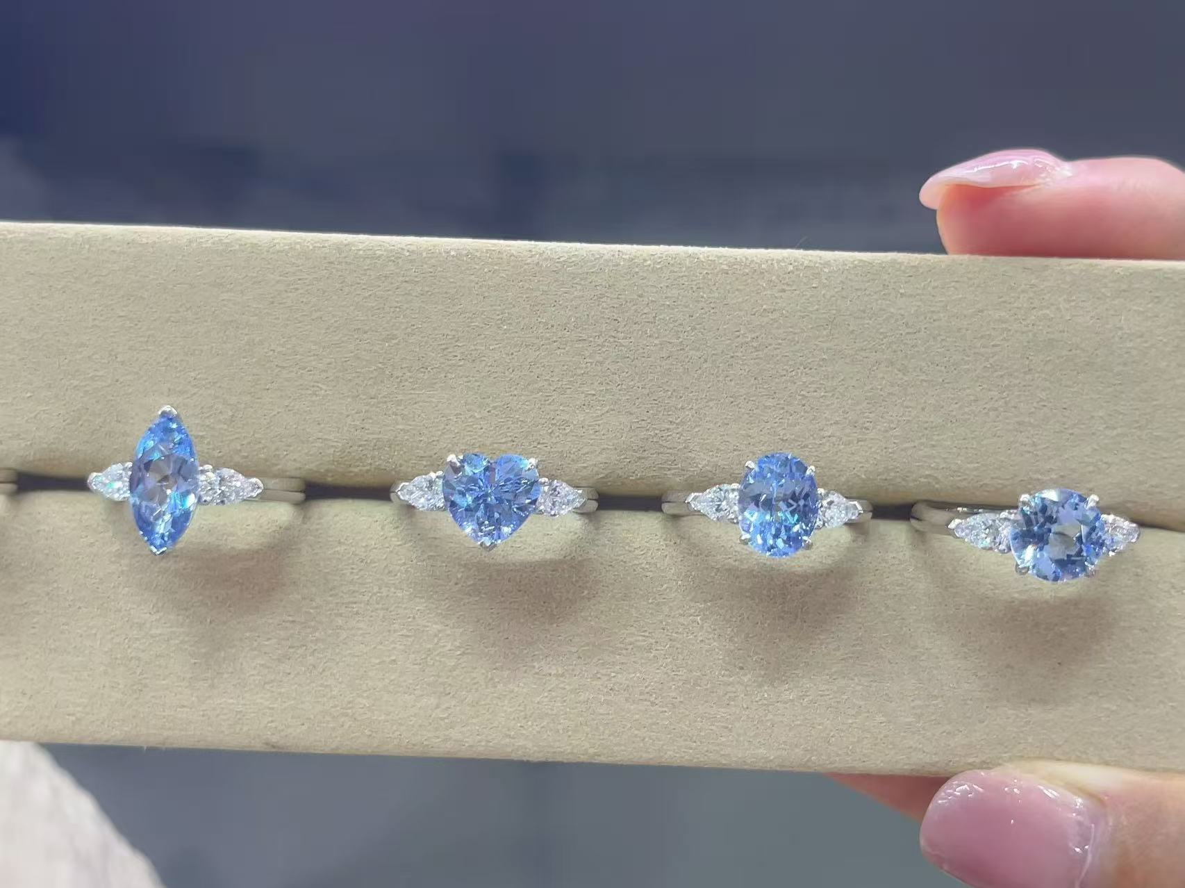 Blue lab diamond ring lineup with emerald pear marquise oval round and other center shapes