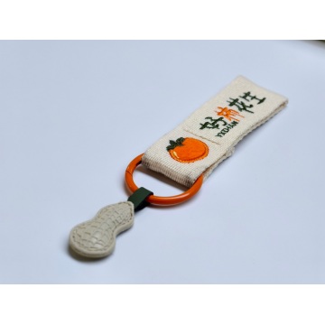 Woven ribbon embroidered logo small pendant