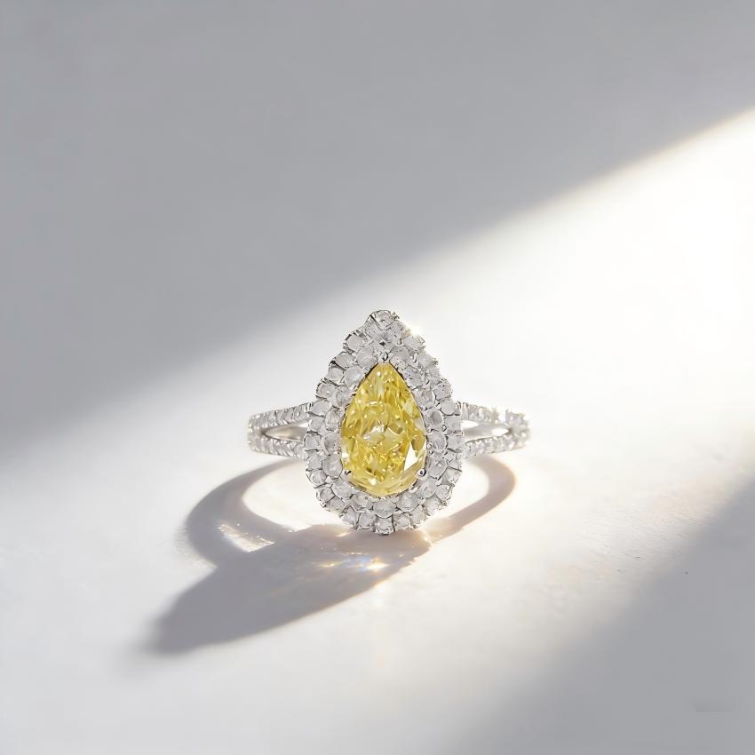 1.13 carat Fancy Intense Yellow pear lab diamond convertible ring with a two-tier halo