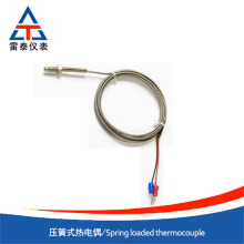 Reliable compression spring thermocouple
