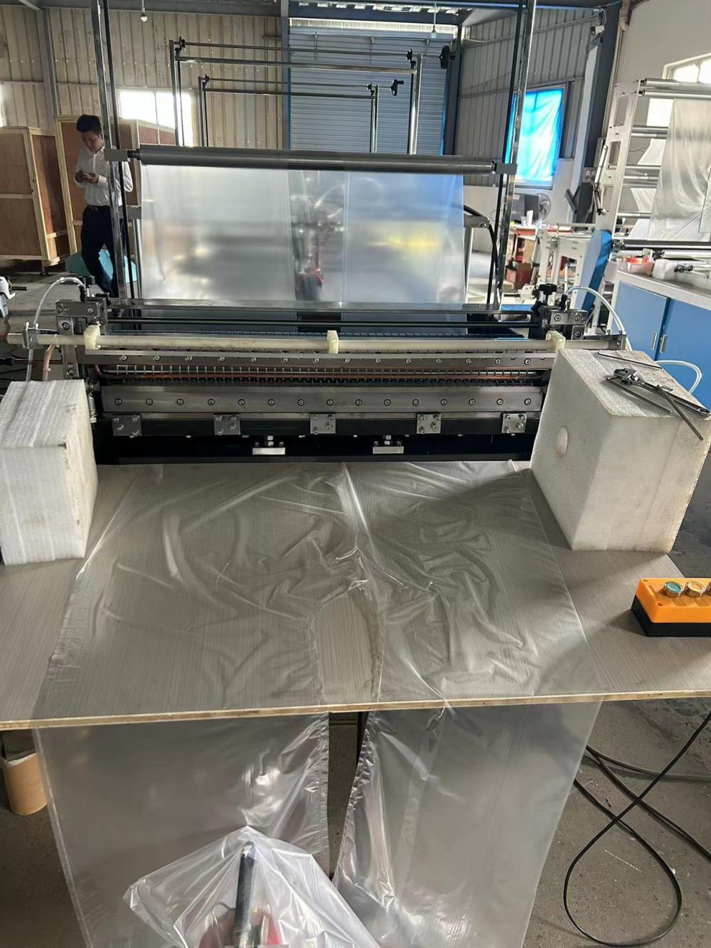 Disposable raincoat making machine