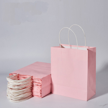 Wholesale light pink kraft paper bag shopping clothing advertising gift bag green handbag supermarket shopping 10 pieces