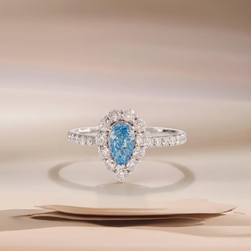 Front view petite teardrop blue halo diamond ring