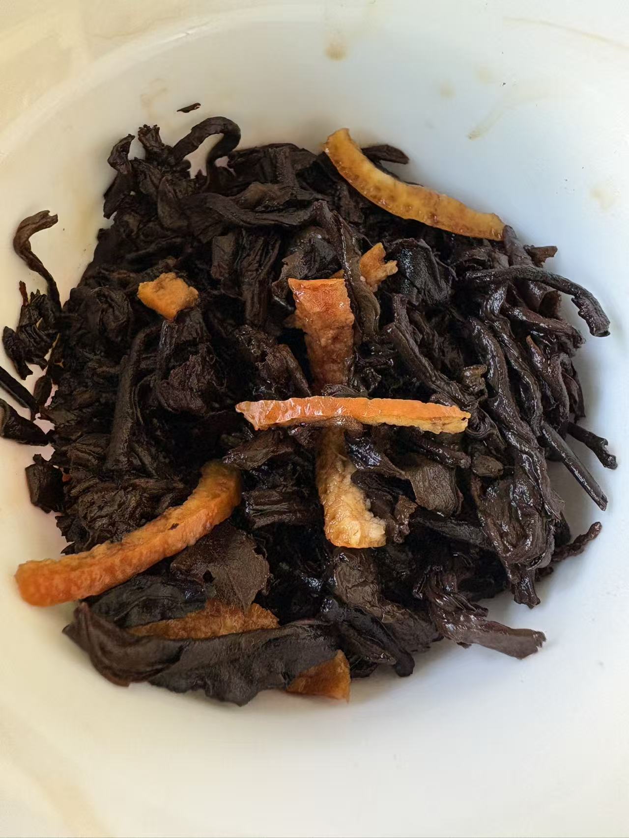 **Tea Leaves of Bingdao Ripe Pu'er with Dried Tangerine Peel**