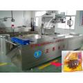 Preserved egg thermoforming vacuum packing machine