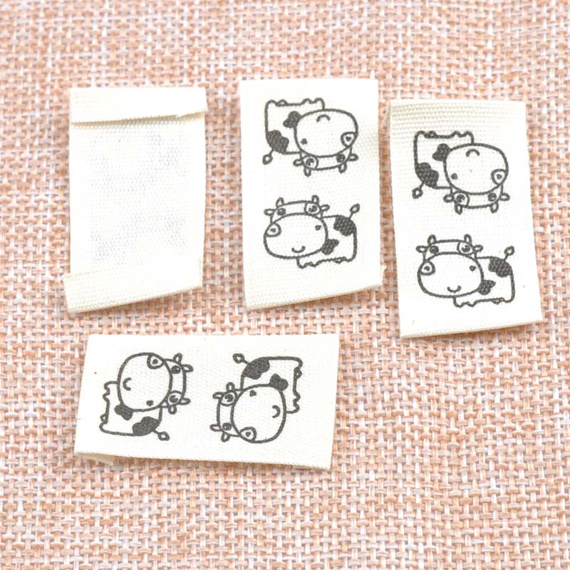 50pcs Beige Woven Labels For Clothing Care Labels Cartoon Cow Woven Labels Clothing Shoes Bags Washable Garment Tags CP1528