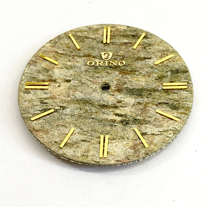 man's stone watch dial