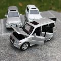 1:32 Scale Mitsubishi Pajero JACKIEKIM Diecast Toy Car Model Doors Openable Sound & Light Educational Collection Gift For Kid
