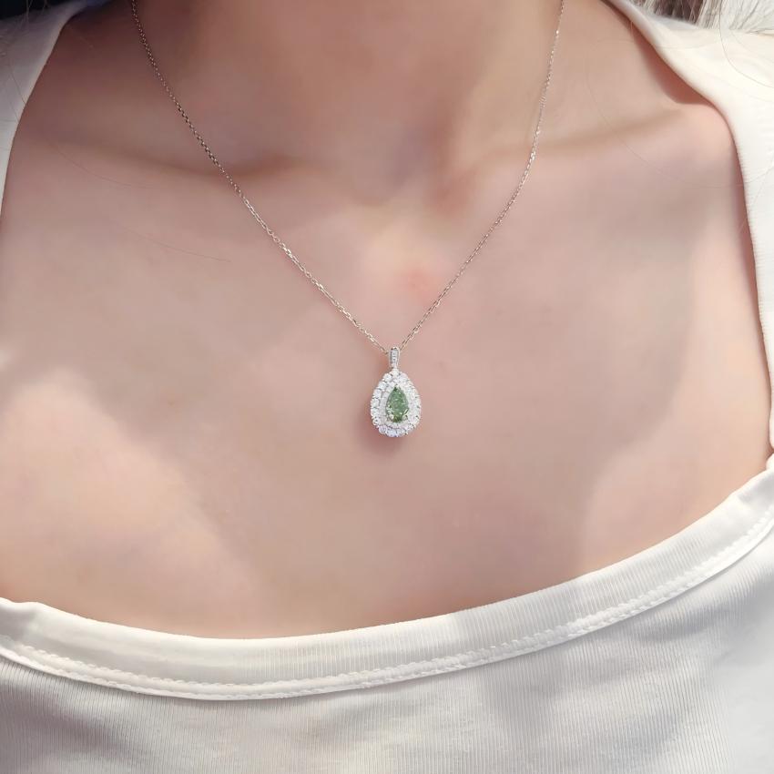 Fancy Vivid Green pear lab diamond detachable double halo pendant shown on chain
