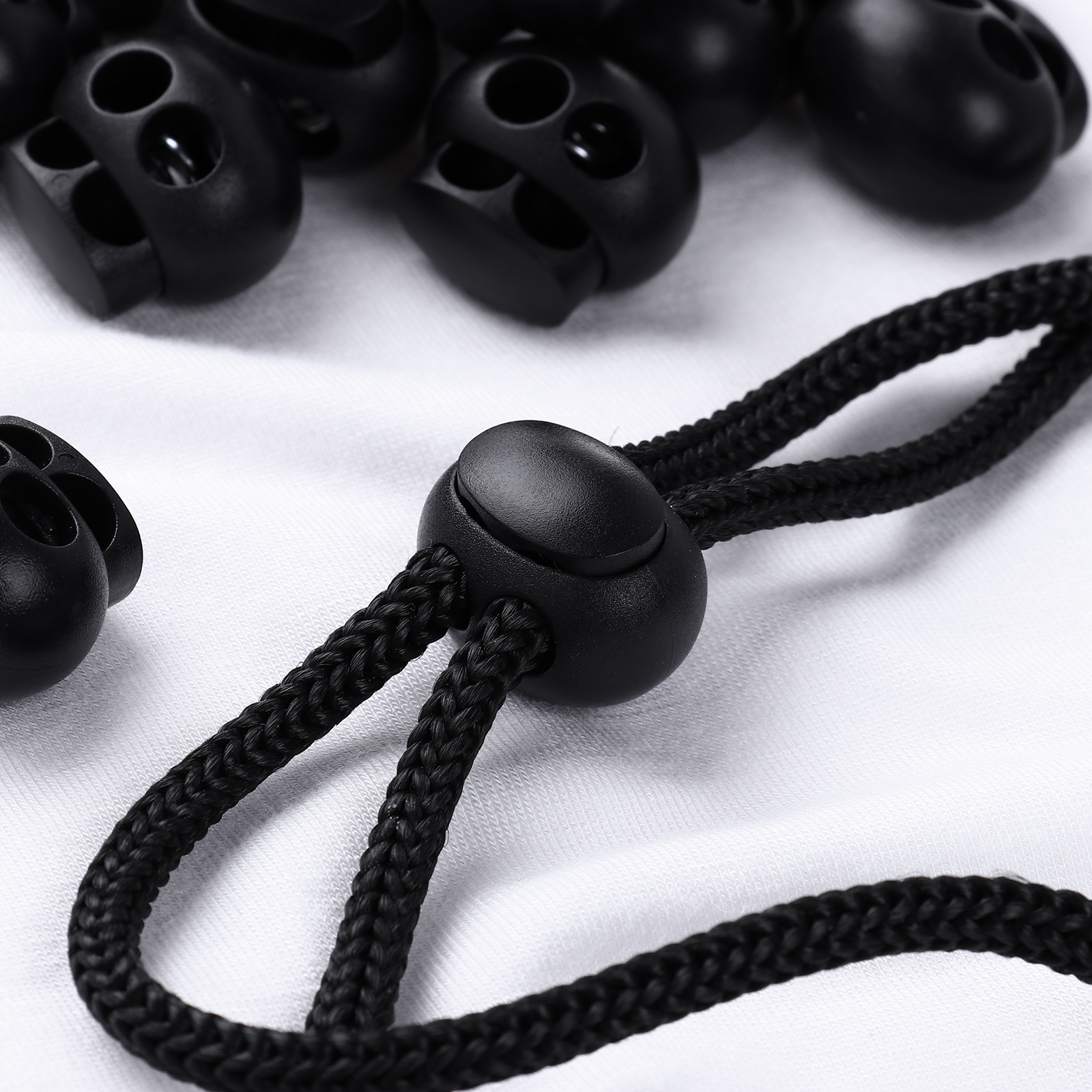 20/50 Black Double Hole Spring Cord Lock Plastic Lanyard Shoelace Fastener Buttons DIY Paracord End Stopper Toggle with Pig Nose