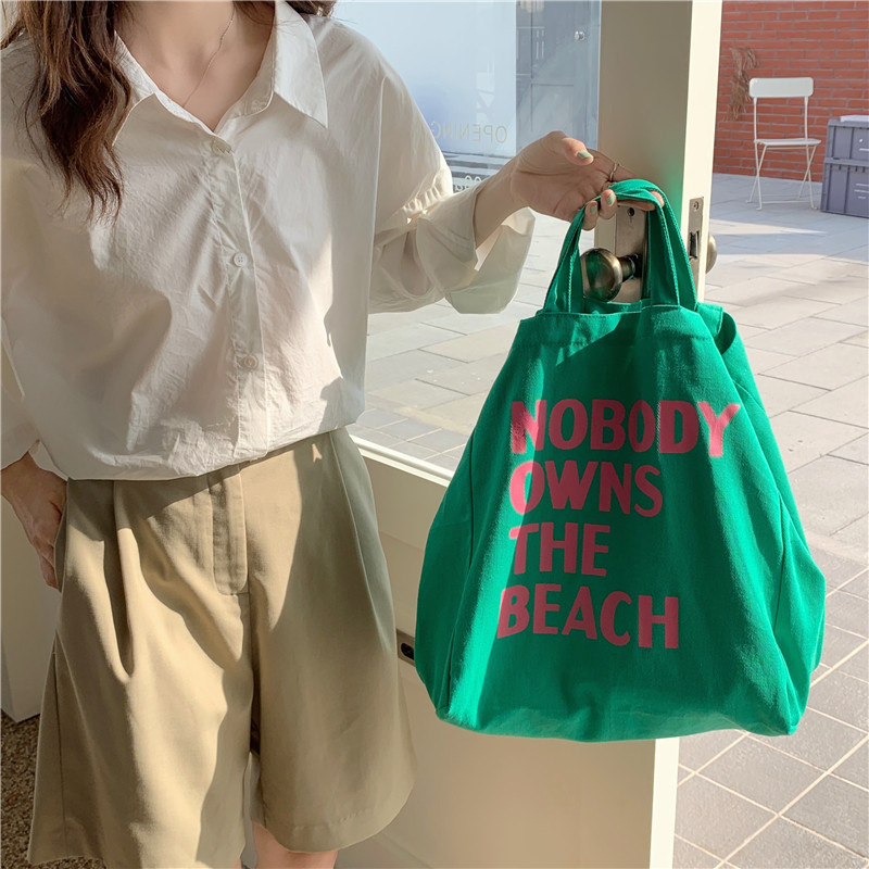green canvas shoulder bag