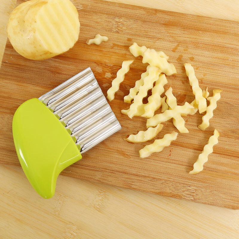 Wave onion potato slices wrinkled french fries salad corrugated cutting chopped potato slices knife