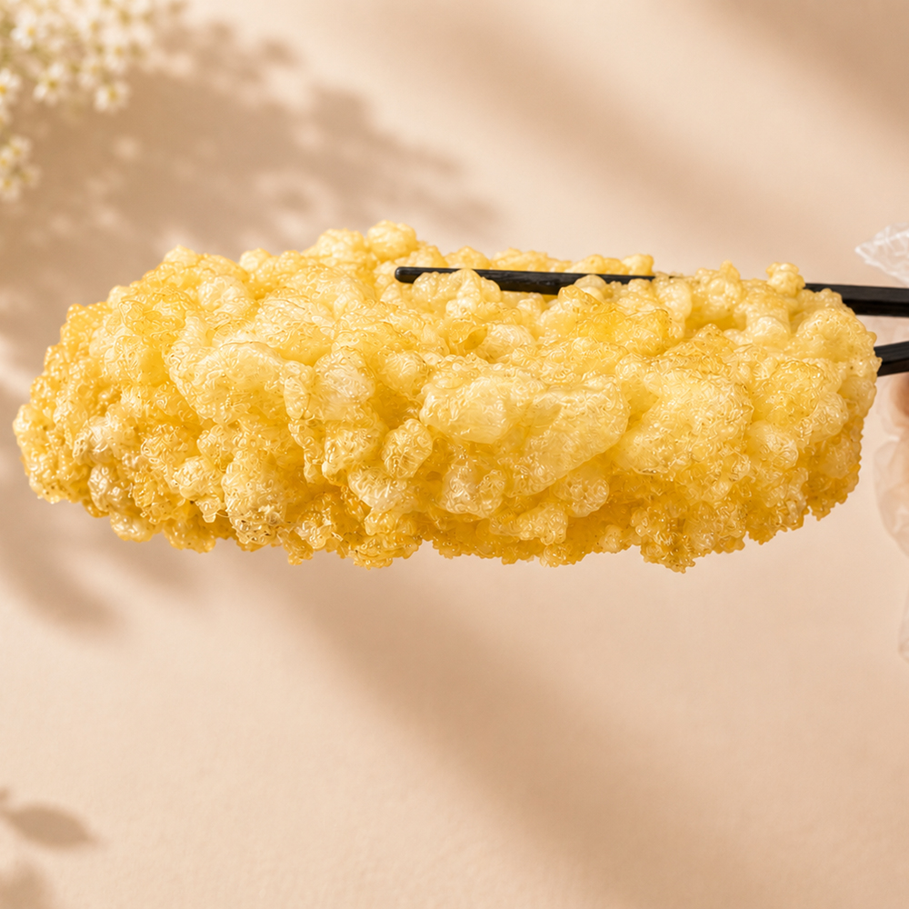 Chopsticks holding golden fried eggs