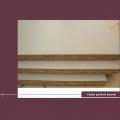 E1 cost of particle board first class