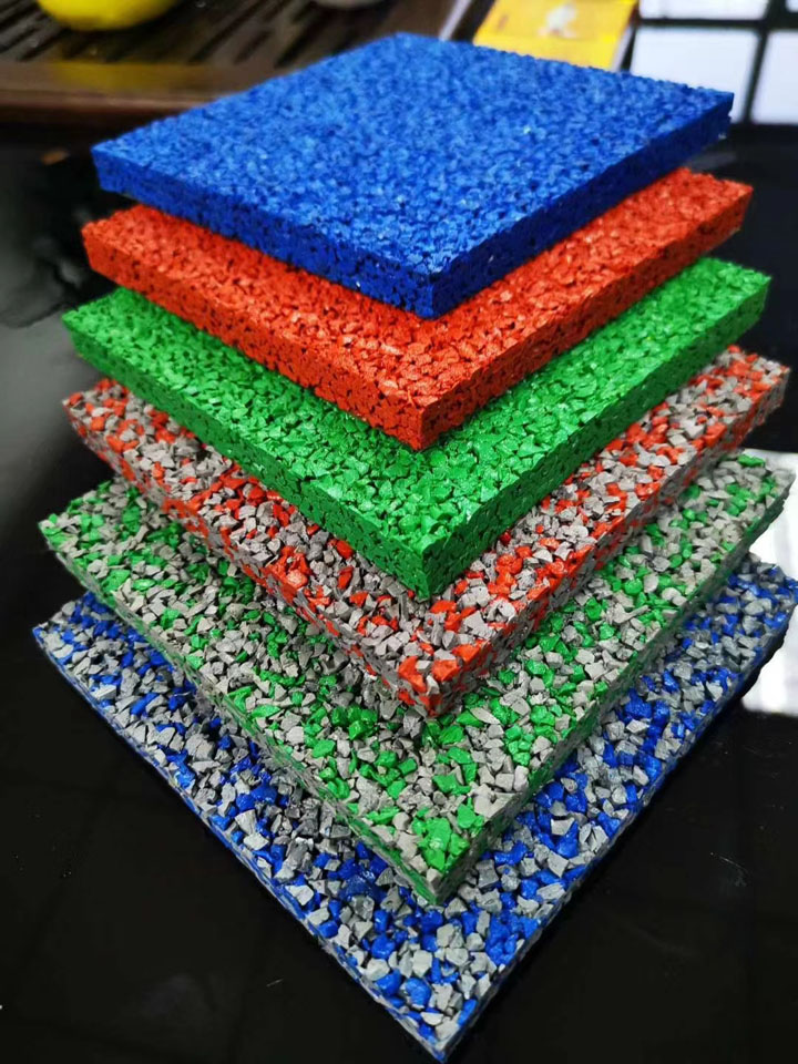 Colored rubber particles