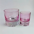 Thick base colored glass candle holder with water drop design