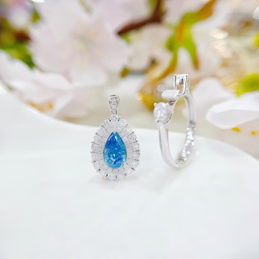 Pear blue halo pendant and ring components shown together