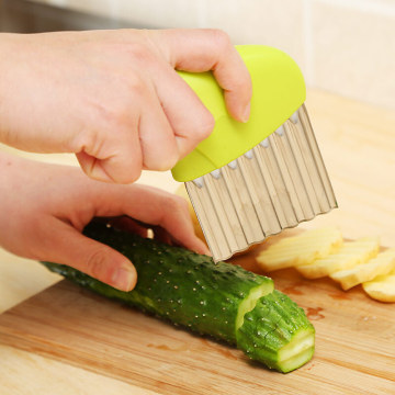 Wave onion potato slices wrinkled french fries salad corrugated cutting chopped potato slices knife