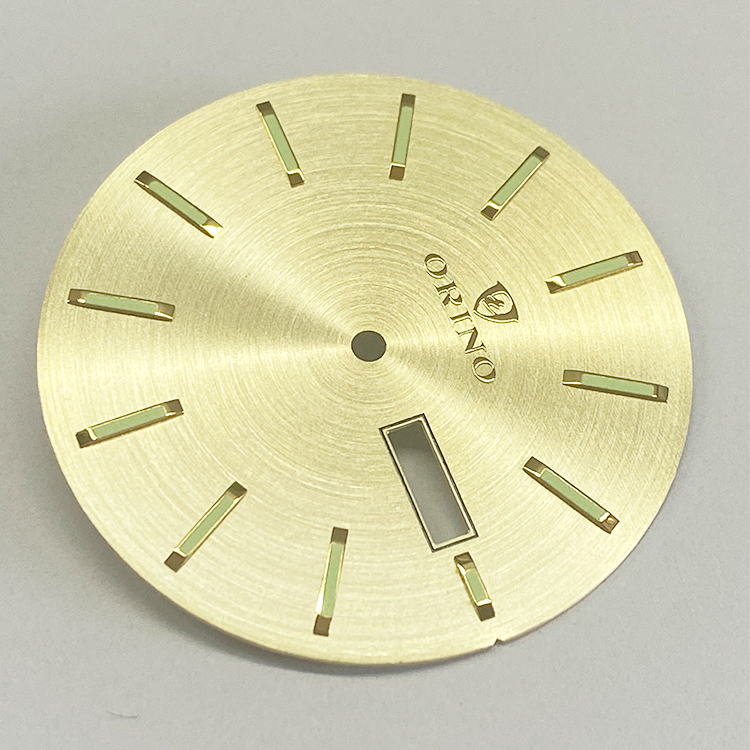 brass dial with luminous 
