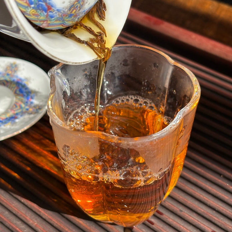 09_Tea_Pouring_Into_Glass_Cup_Organic_Congou_Black_Tea.jpg